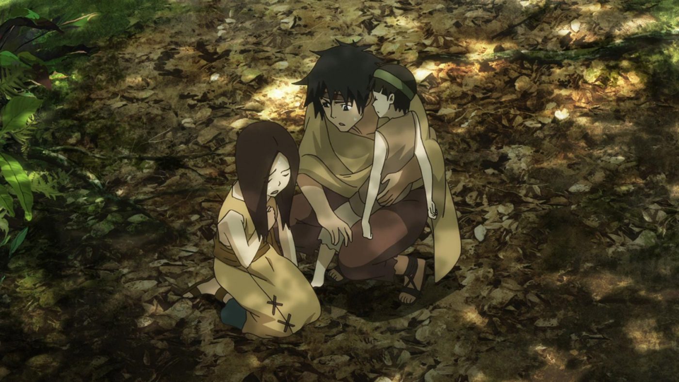 An injured family gather on the forest floor