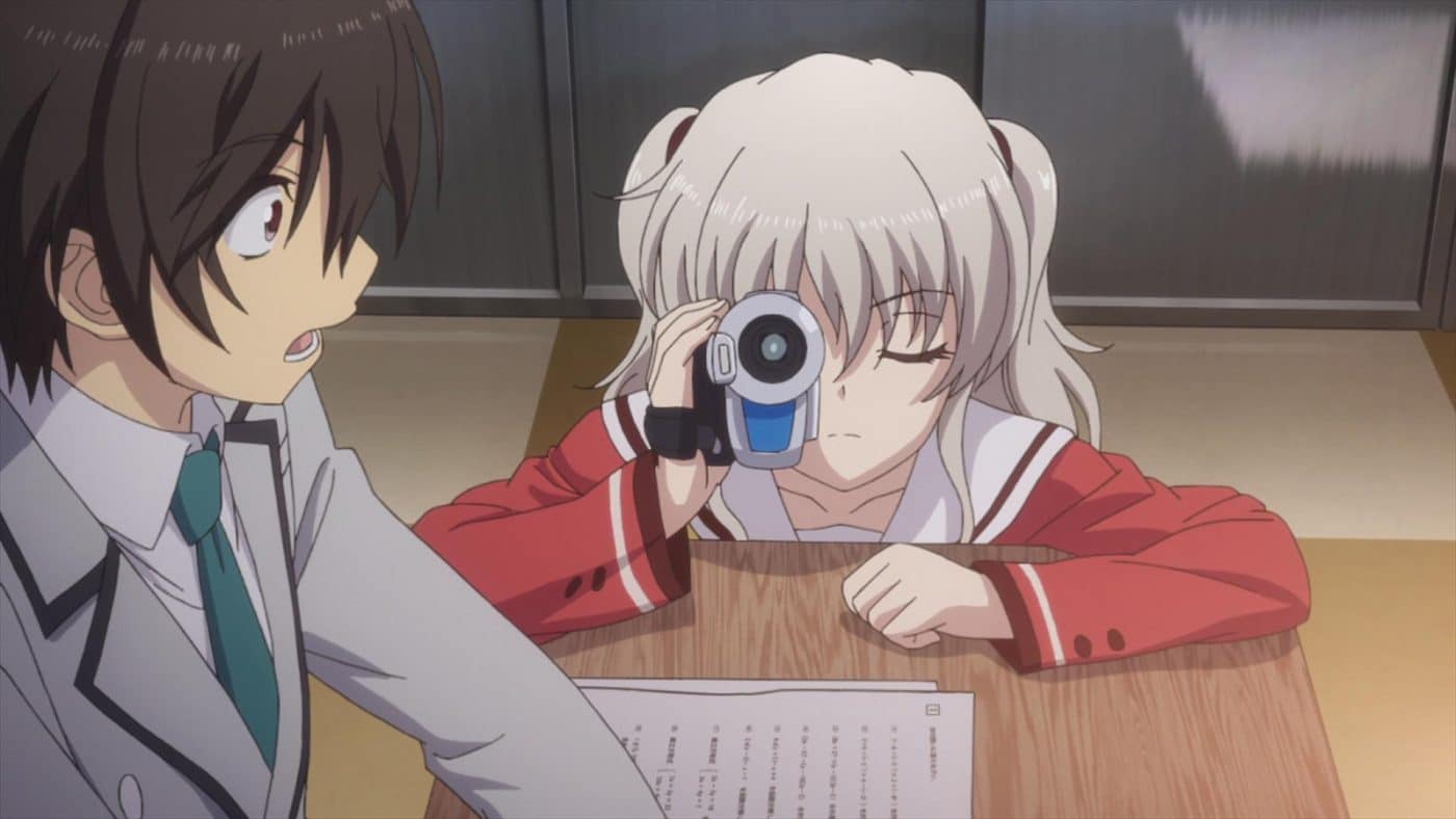 As Yuu takes a test, Nao appears next to him with a camera